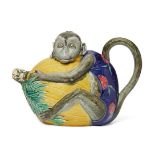 A Minton majolica tea pot and cover, 19th century, in the form of a monkey clasping a fruit,