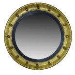 A Regency style gilt framed circular wall mirror, 20th Century, the convex plate set within ebonised