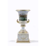 A Lippert and Haas porcelain campana urn on a plinth, early 19th century, the urn decorated with a