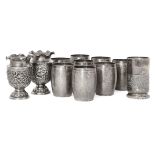 Eight Indian barrel beakers, seven stamped T100 for silver, each designed as a barrel and