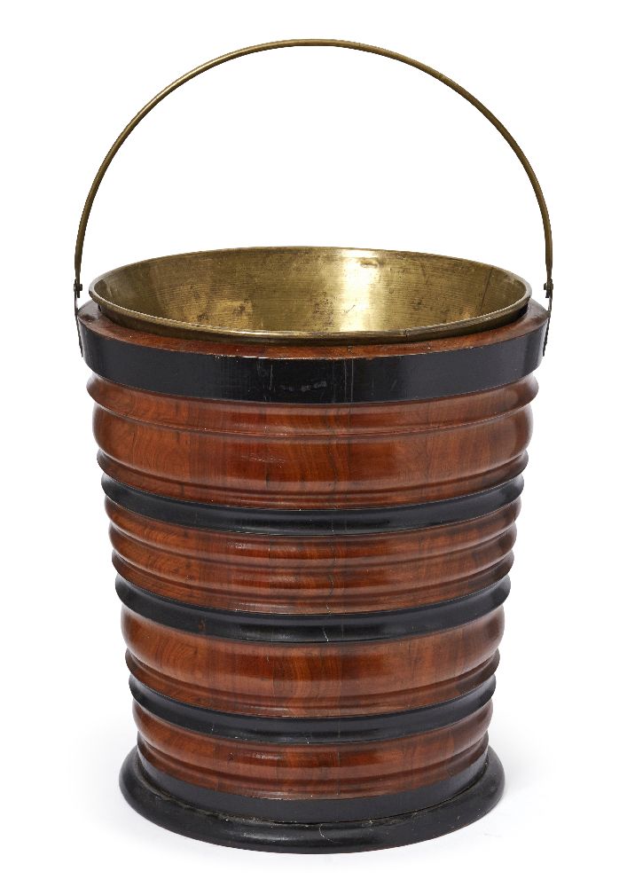 A Dutch walnut and ebonised wood peat bucket, 19th century, with a brass liner, 32cm highPlease