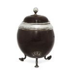 A Georgian silver mounted coconut tea caddy, the lid with a knop form finial with petal form