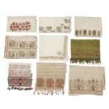 A collection of Turkish embroidered linen towels and cloths, mostly early 20th century, together