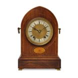 An Edwardian rosewood and line inlaid lancet shaped mantel clock by Robert Leamington, with bats