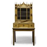 A Gothic Revival bookcase on associated stand, late 19th Century/early 20th Century, of