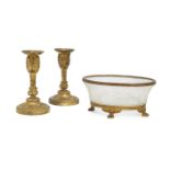 A pair of French ormolu candlesticks, late 19th/early 20th century, the columns with cast foliate
