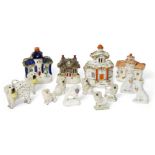 A collection of four Staffordshire pottery pastille burners, in the form of houses, 19th century,