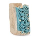 A deeply carved Timurid turquoise tile fragment, Central Asia, late 14th-early 15th century,