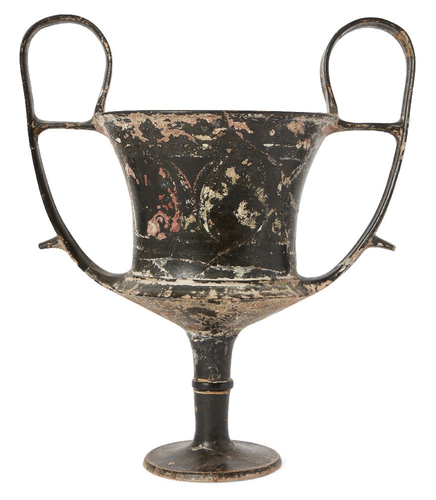 A large Boeotian black glazed kantharos, circa 5th Century B.C., with carinated lower body, on a