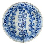 An Iznik blue and white pottery bowl, Turkey, 17th century, of shallow form with everted rim,