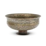 A large Safavid tinned copper bowl, Iran, late 17th century, the bowl rising from a short