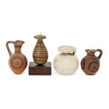 Four pottery vessels, including a Corinthian spherical aryballos with worn lotus decoration, 6.