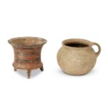 An intact unglazed pottery jug of globular form with small loop handle, Iran, 1st millennium B.C.,