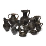 A group of eleven Etruscan bucchero ware vessels, circa 7th-6th Century B.C., comprising a large