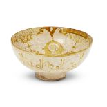 An intact Kashan lustre-painted bowl, Iran, circa 1170-1200AD, of deep form with rounded sides, on