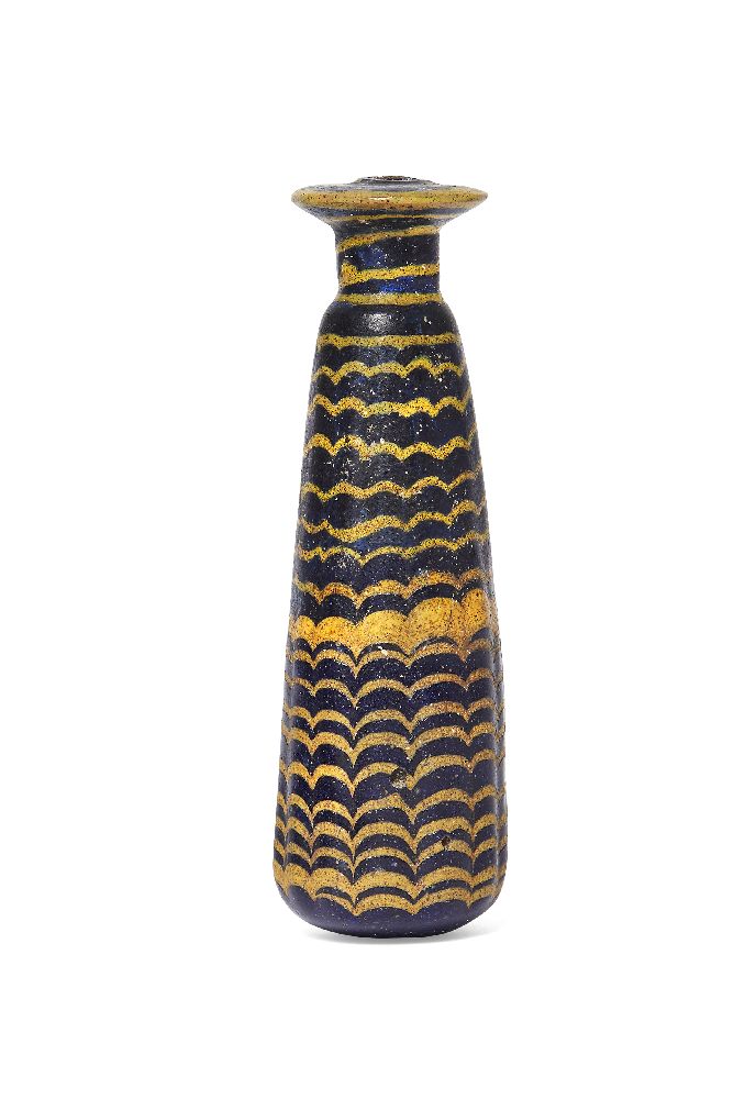 A Greek core-formed blue glass alabastron, circa 2nd-1st Century B.C., the vertical ribbed body