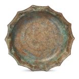 A large Khorasan silver and copper inlaid inscribed basin, Northeast Iran, 12th century, the flat