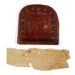A reproduction Egyptian round-topped stele, of red glazed pottery with an offering scene and