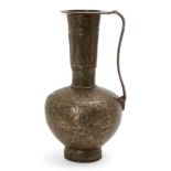 A Khorassan bronze ewer, Iran, 12th century, the compressed globular body on a short straight