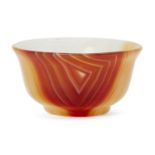 A small carved agate bowl, India or Iran, 19th/20th century, on a short foot, with flared sides, 2.