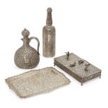 A silver repousse bottle, a flask, a tray and a cigarette box, India, second half 19th century,