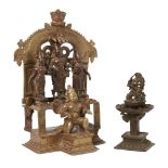 A bronze triad of Vishnu, Shridevi and Bhudevi set into a shrine with Garuda, South India, 17th