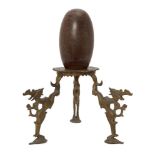 A brass tripod stand and lingham stone, Deccan, India, 19th century, the stand with three rearing