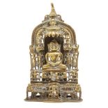 A Jain brass shrine, South India, 18th century, the central figure of Tirthankara seated on a