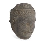 A Gandhara grey schist head of a Bodhistava, Afghanistan, 2nd-3rd century, his face finely