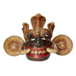 A wooden mask of Dala Yaka, Ceylon (Sri Lanka), circa 1900, the grotesque face with projecting