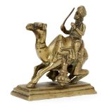 A brass figure of a camel driver, India, circa 1800, on a rectangular tiered base, the camel shown