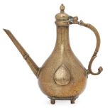 A Mughal brass ewer, Northern India, 18th century, of pear-shaped form with s-shaped handle and