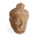 A Gandhara terracotta head of a Buddha, Afghanistan, 3-4th century, modeled with pronounced nose,