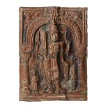 A copper votive plaque of Shiva, South India, 19th century, of rectangular form, Shiva depicted in