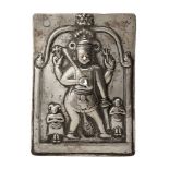 A silver repousse plaque of Shiva, South India, 19th century, of rectangular form, Shiva depicted in