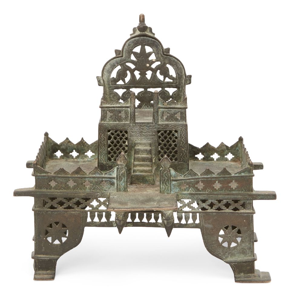 A tinned copper shrine, India, 19th/early 20th century, on four feet, in two tiers, with steps