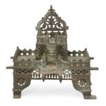 A tinned copper shrine, India, 19th/early 20th century, on four feet, in two tiers, with steps