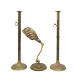 A pair of tall brass candlesticks, 19th century, with side ejectors, on domed circular bases, 60cm