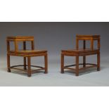 A pair of Chinese hardwood stands, late 20th Century, of rectangular form, each with raised shelf