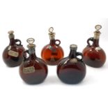 Five brown flask shaped white metal mounted decanters, 19th century, each bearing white metal wine