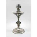 A silver plated metal lamp base, 20th century, the top with pierced collar and shell support,