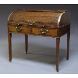 A George III mahogany roll top tambour desk, late 18th century, the tambour front enclosing an