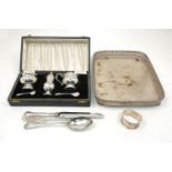 A boxed small silver condiment set, Birmingham, c.1957, Adie Brothers, comprising two blue glass-