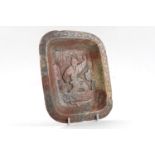 A Chinese rectangular soapstone dish, late 19th/early 20th century, carved with a figure of a