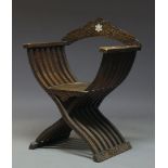 A hardwood and mother of pearl inlaid Savonarola chair, first half 20th Century, with overall floral