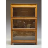 A Globe Wernicke style sectional bookcase, early 20th Century, with three glazed compartments on