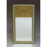 An Art Deco green painted and parcel gilt wall mirror, c.1930, of rectangular form, the frieze