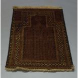 A Belouch prayer rug, 134cm x 88cm, together with a Kazak rug, an Indian Dhurry and a Turkmen rug (