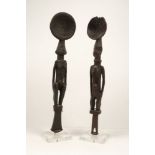 A pair of tribal hardwood female fertility figural spoons or ladles, 20th century, mounted on