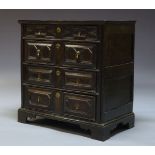 A Charles II oak chest of drawers, the rectangular top above four long drawers, the drawers with